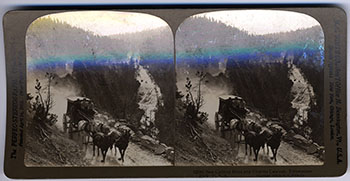 stereoscope image of horses pulling a stagecoach through a canyon