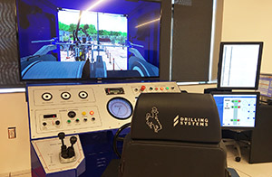 chair, controls and screen of drilling simulator