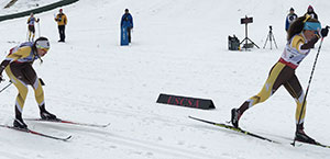 two Nordic skiers competing