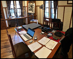 dining table set up as office