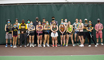 group of people posing with tennis racquets