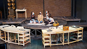 three women on a stage