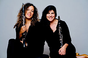 two women holding clarinets
