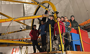 group of school children on a platform in an obsevatory