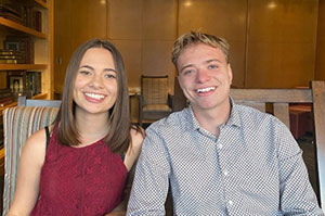 woman and man sitting beside each other