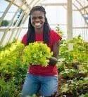 Woman holding lettuce