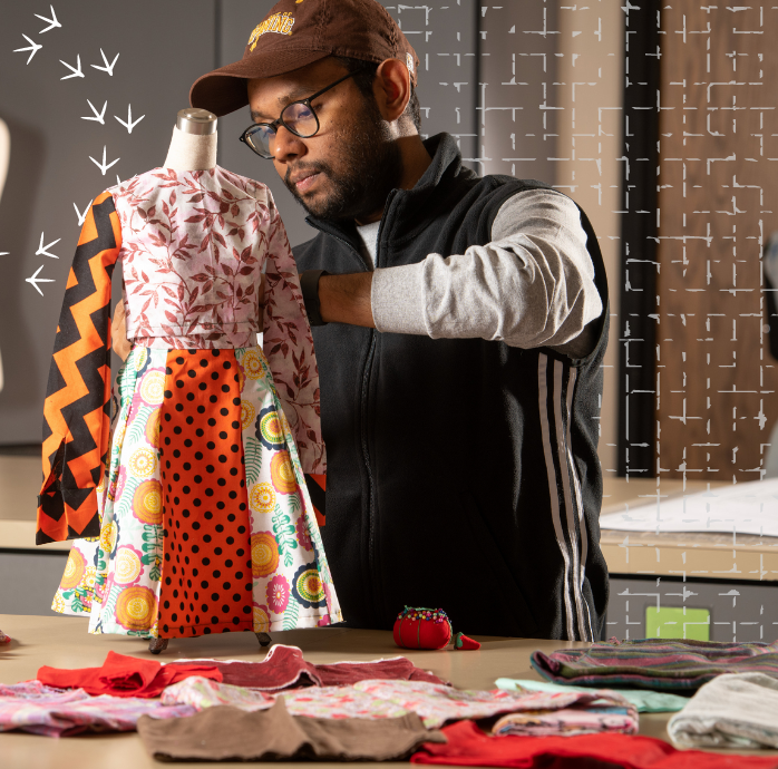 student creating a textile garment.