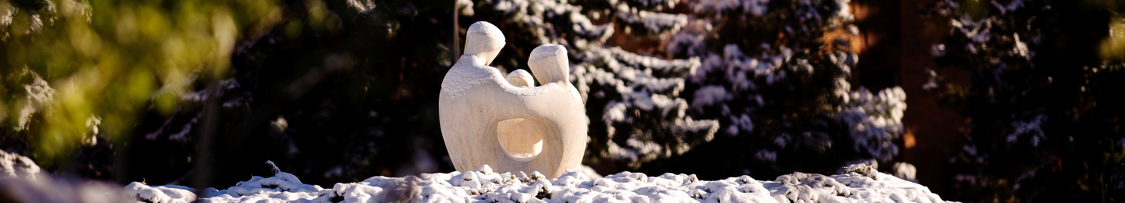 A statue in the center of Prexy's Pasture on UW campus.