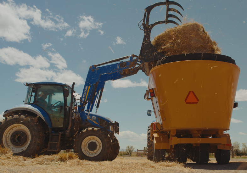 Tractor loading hay
