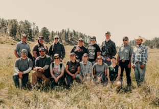 Ranch camp students group photo in a field