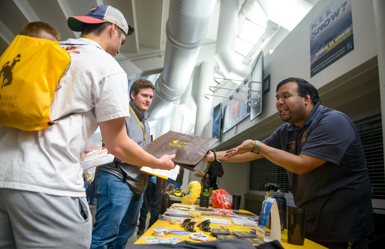 Students visit a table at UW's New Student Day.