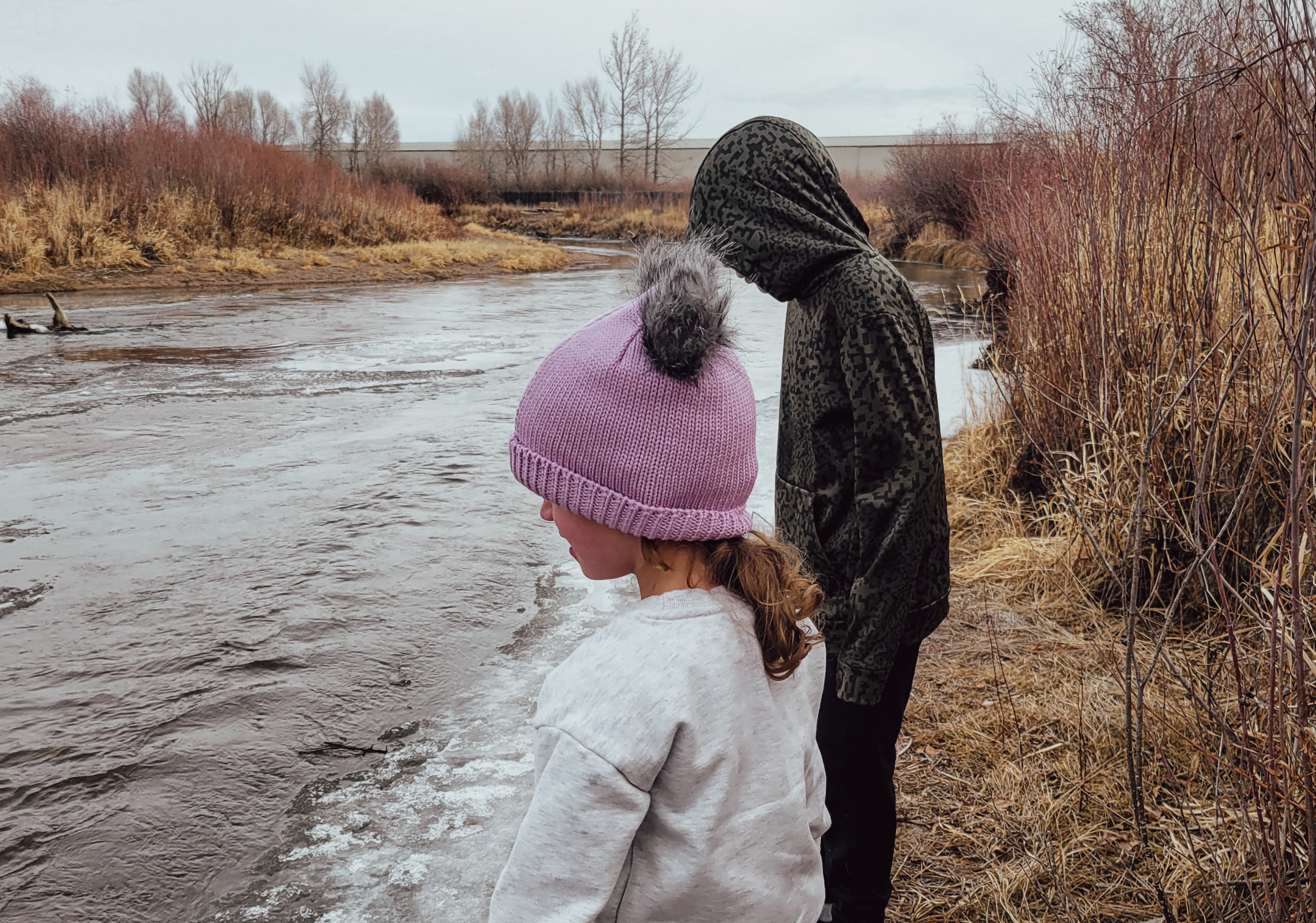 Two participants visit the Laramie River for a winter nature walk— their favorite activity in January. Photo courtesy of Kristin Dale Lanouette.