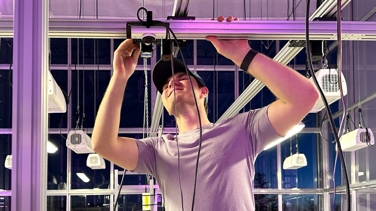 student fixing grow light