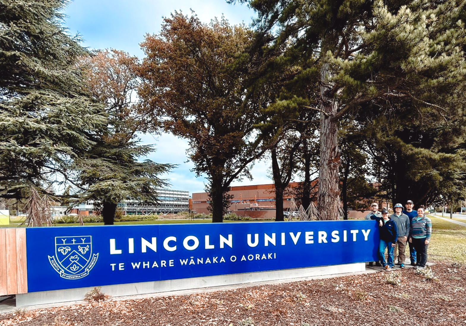 Educator in front of Lincoln University sign