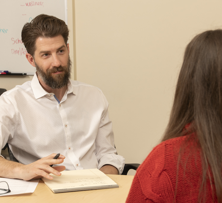 Teacher talking to student