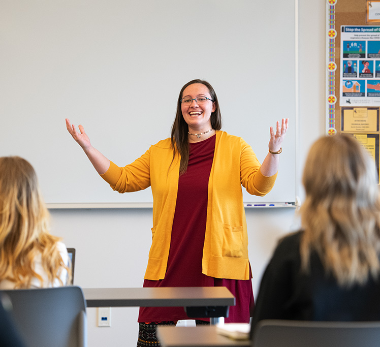 Teacher lecturing and smiling