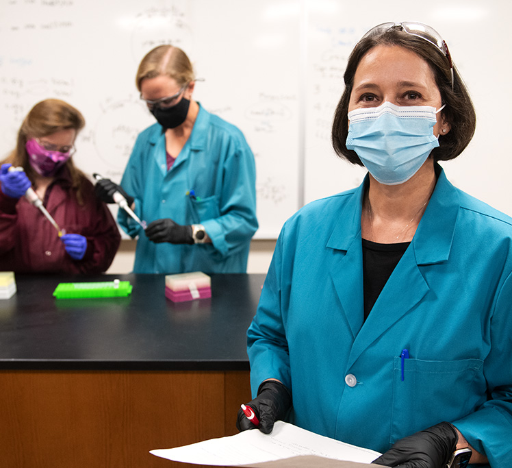 Teacher and students in lab