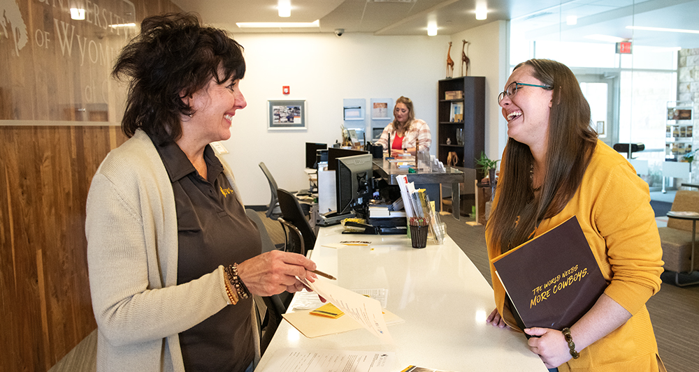 Two women talking and smiling