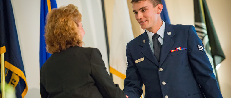 Student in Uniform shaking hands 