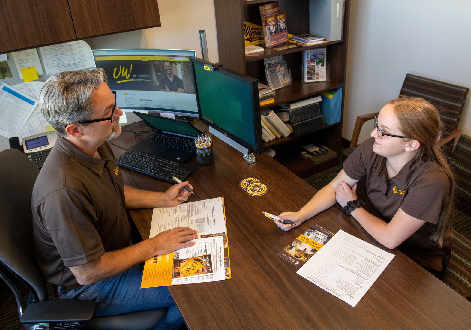adviser meets with a student