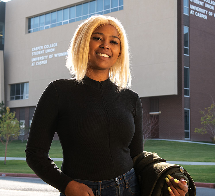 Student standing in front of UW Casper building