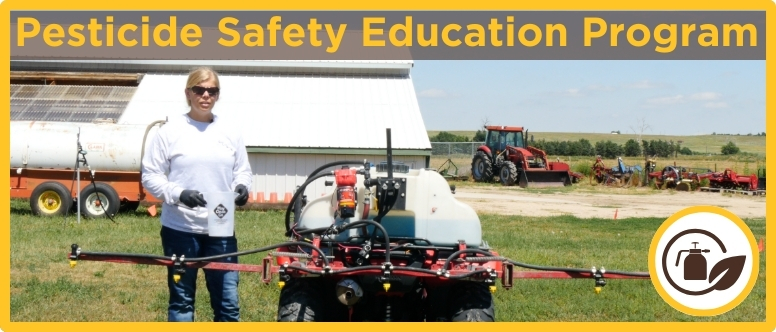 a woman stands next to an ATV with a boom sprayer attached