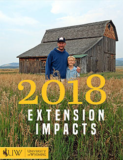2018 impact statement cover dad and son in front of barn
