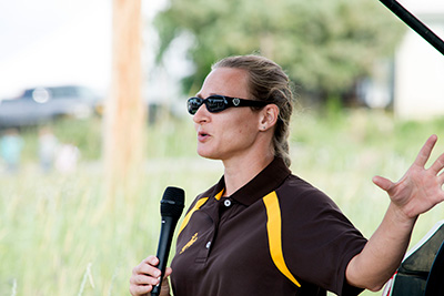 Beth Fowers speaking with a microphone