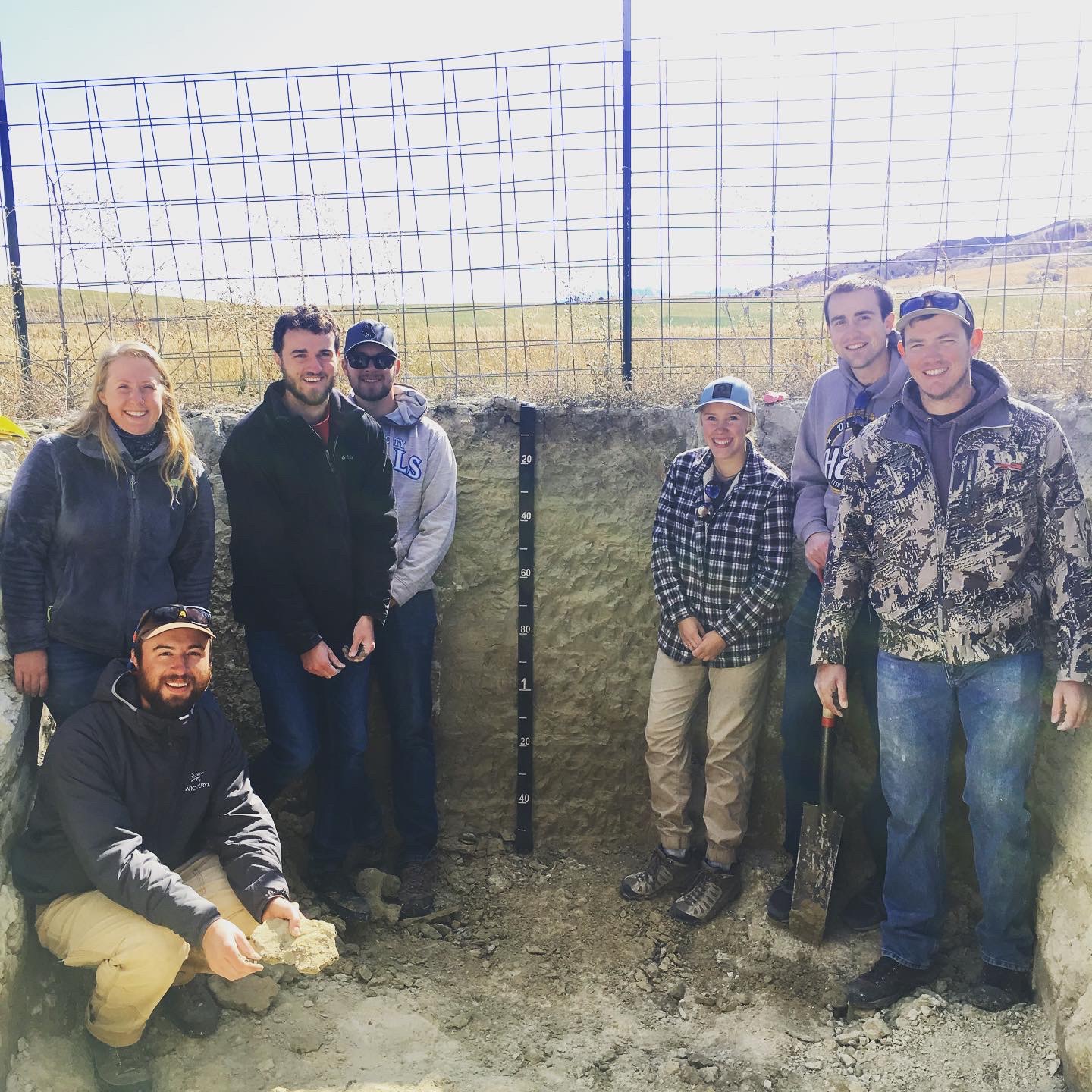 Soil judging team inside a soil pit at the competition