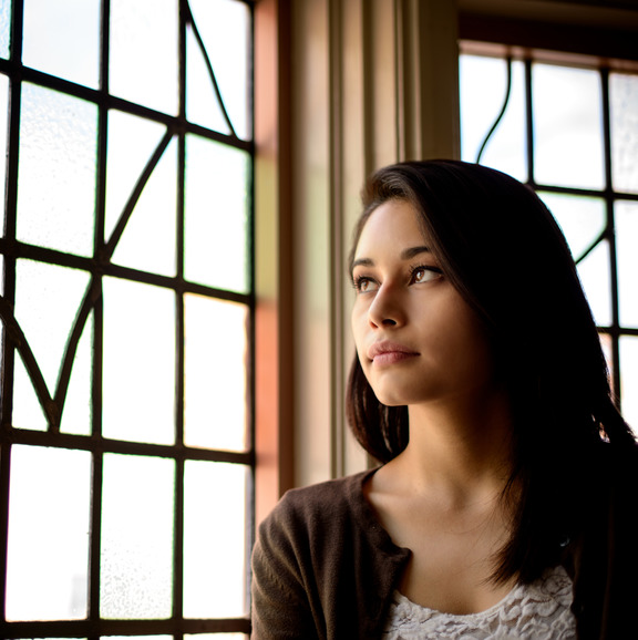 Person looking out window.