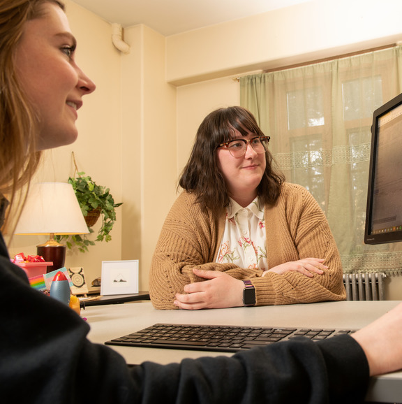 students working together on a computer