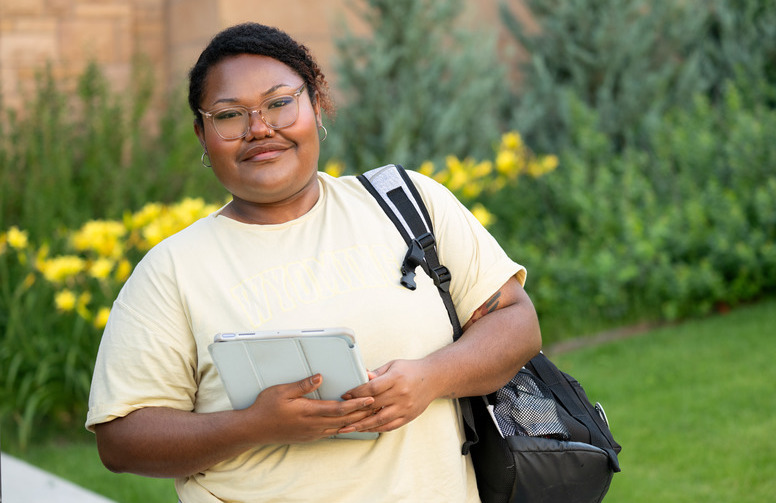 A student smiles for a photo
