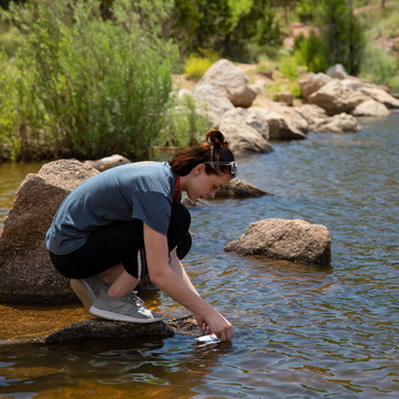 A student takes a water sample