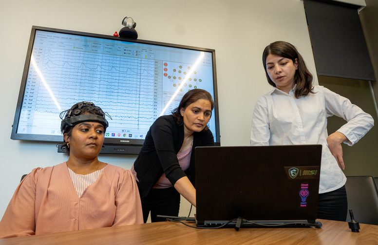 Three people in a lab