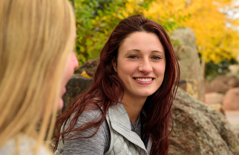 A student smiles for a picture