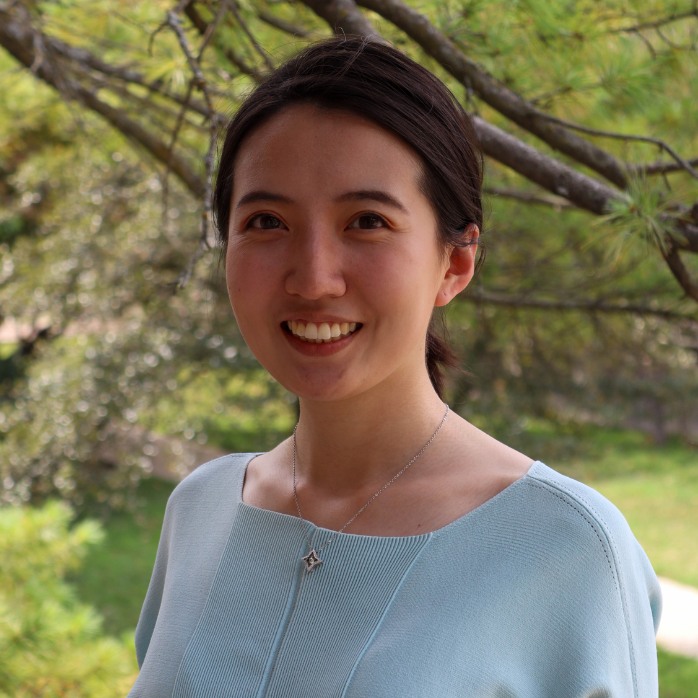 Yu Song smiling for a portrait