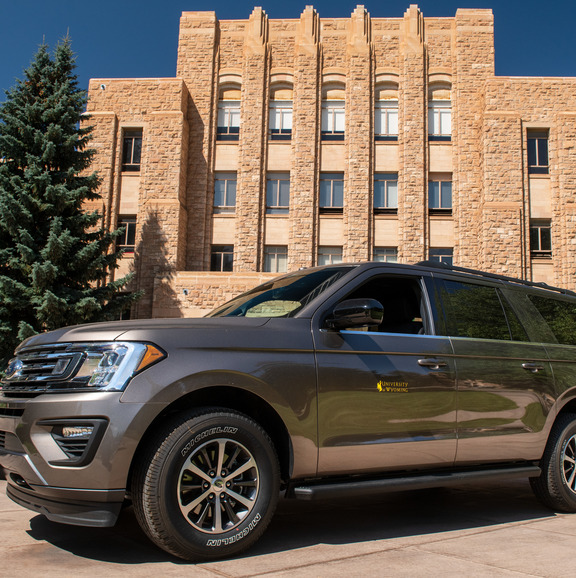 Car in front of arts and sciences building. 