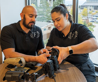 Ana Acevedo and Jesus Acevedo show their tactical gear