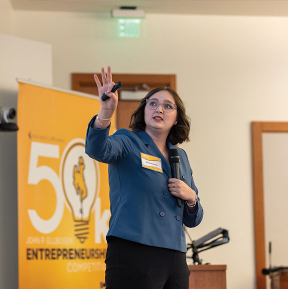 woman presenting at a business competition