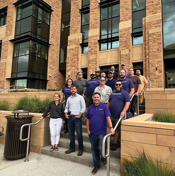 group of people on the steps of the engineering building