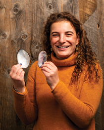 woman holding seashells