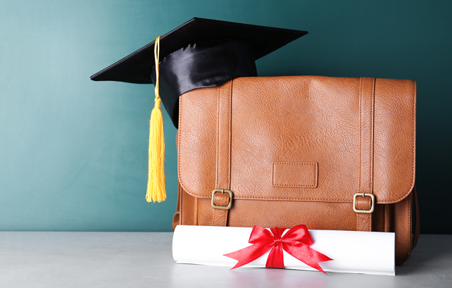 graduation cap, diploma and briefcase