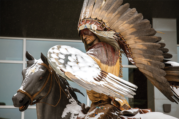 Statue of a Native American chief riding a horse