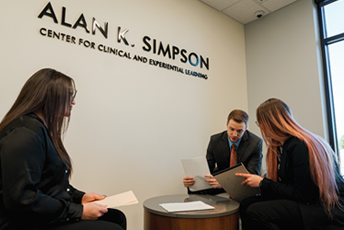 Three law students at the College of Law’s Alan K. Simpson Center for Clinical and Experiential Learning