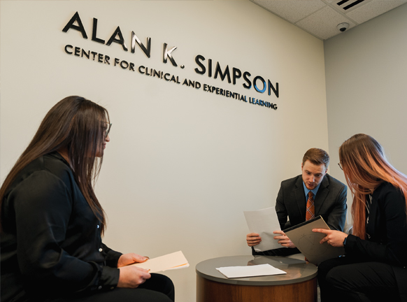 Three law students at the College of Law’s Alan K. Simpson Center for Clinical and Experiential Learning