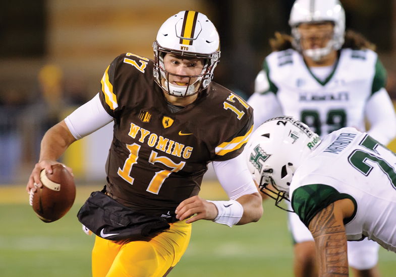 football player running with the ball during a game