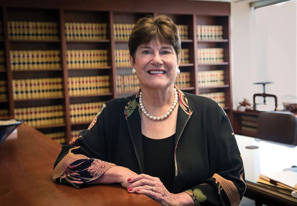 woman standing in a law library