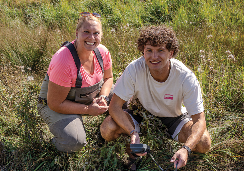 professor and student by the Laramie River