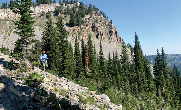 student walks in the Wyoming mountain range