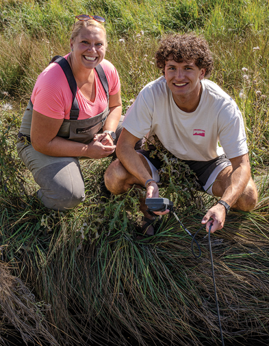 students and professor explore Spring Creek in Laramie